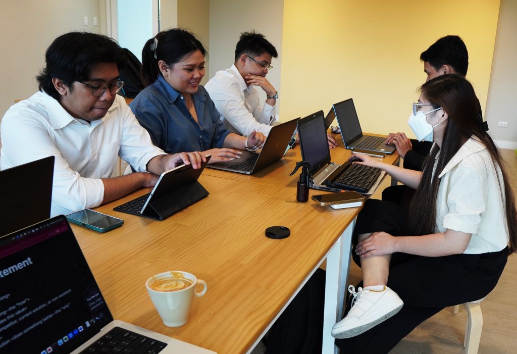 Predictive Systems Inc Team all working and collaborating with each other