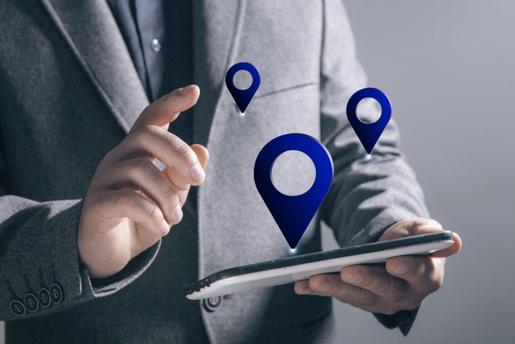 gps icon. man holding a phone in his hand